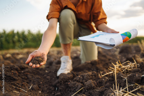 Obraz na plátně Female Hand of expert farmer collect soil and checking soil health before growth a seed of vegetable or plant seedling
