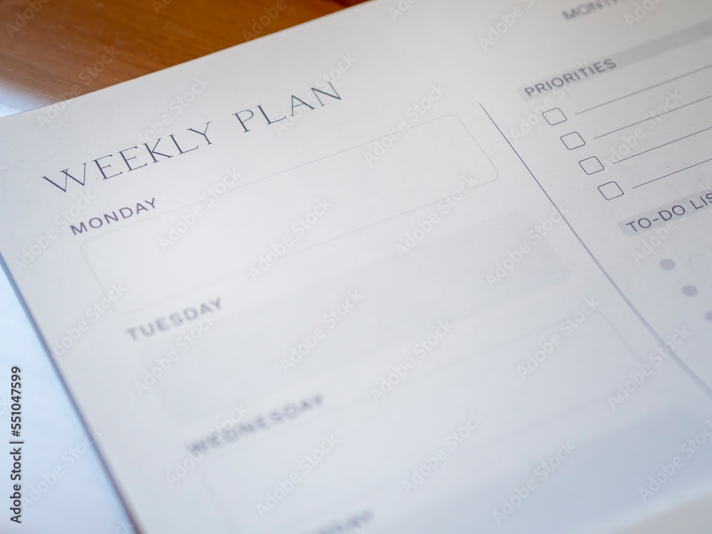 Close-up of weekly plan paper for organizing schedule and productivity planning. Week planner printable with priorities and to-do list for daily organization. Close-up of weekly plan paper for organizing schedule and productivity planning. Week planner printable with priorities and to-do list for daily organization.