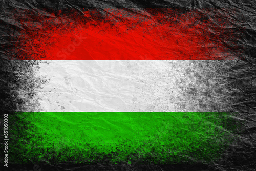 Flag of Hungary. Flag is painted on black crumpled paper. Paper background. Copy space. Textured background