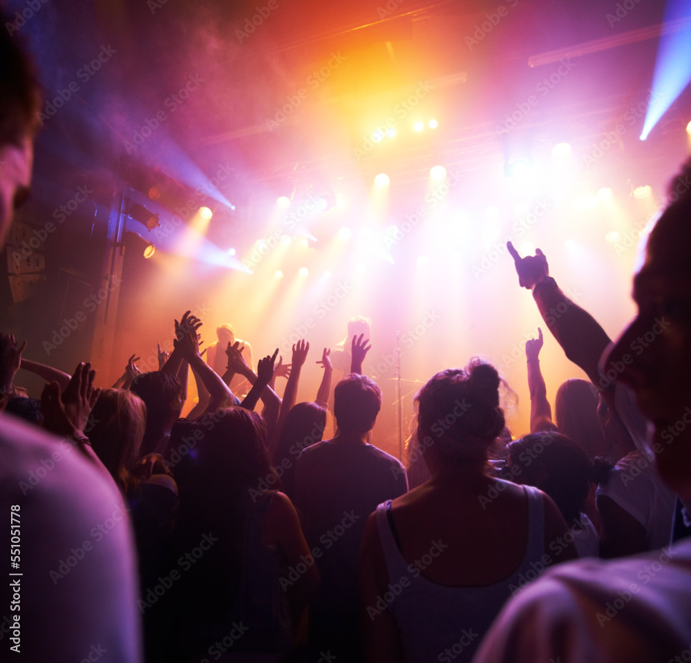 Crowd, stage lights and live band music in party event, nightclub festival or dance floor concert. People, musicians and audience dancing in spotlight social disco, techno rave or rock entertainment