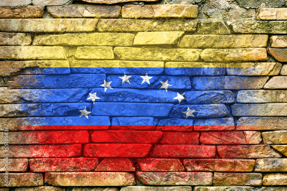 Flag of Venezuela. Flag is painted on a stone wall. Stone background. Copy space. Textured background Flag of Venezuela. Flag is painted on a stone wall. Stone background. Copy space. Textured background