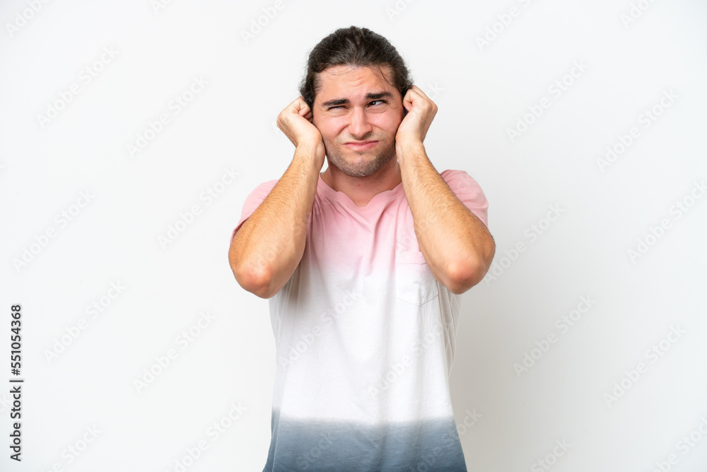 Caucasian handsome man isolated on white background frustrated and covering ears Caucasian handsome man isolated on white background frustrated and covering ears
