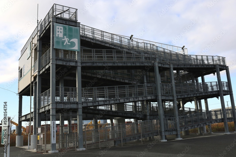 Sendai, Miyagi, Japan, December 2022.Nakano 5-chome Tsunami Evacuation Tower and surrounding scenery. Sendai, Miyagi, Japan, December 2022.Nakano 5-chome Tsunami Evacuation Tower and surrounding scenery.