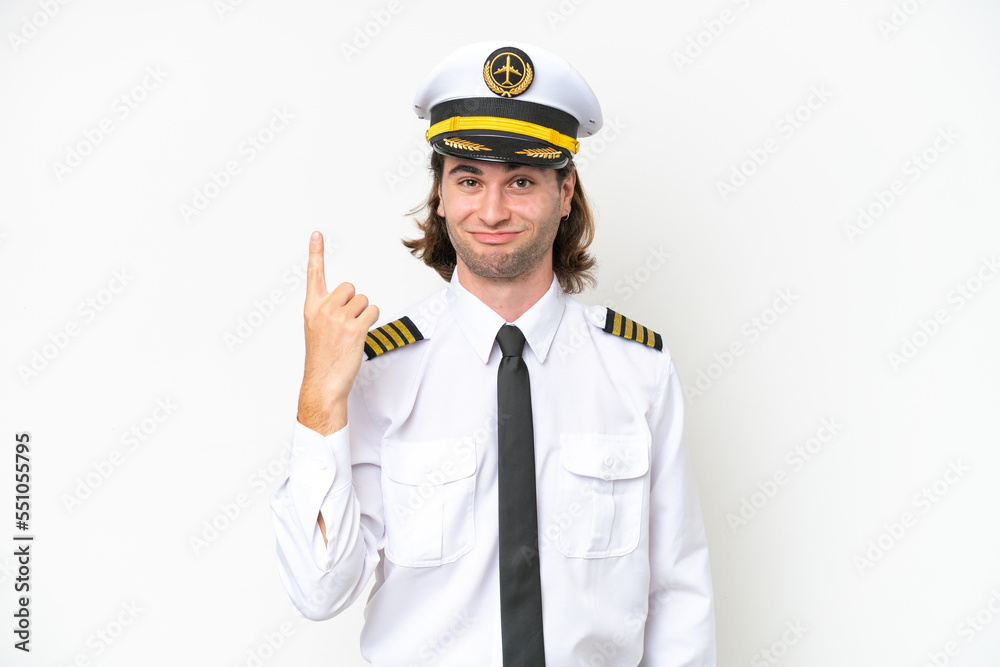 handsome Airplane pilot isolated on white background pointing with the index finger a great idea