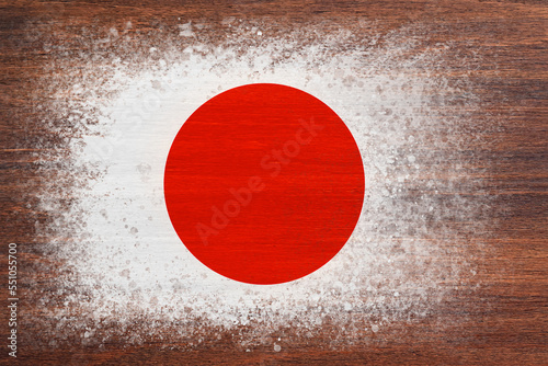 Flag of Japan. Flag is painted on a wooden surface. Wooden background. Plywood surface. Copy space. Textured background