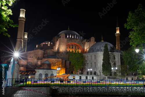 The Hagia Sophia Mosque (Ayasofya Camii) at night with a flares in the sky. View from the Sultanahmet Park. Istanbul, Turkey. photo