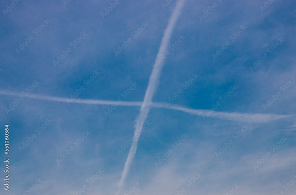 A cross in the sky made by the tracks of some planes A cross in the sky made by the tracks of some planes