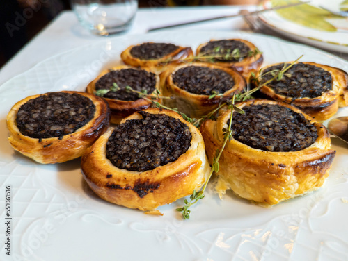 Bild auf Leinwand black pudding with rice on puff pastry, delicious spanish dish