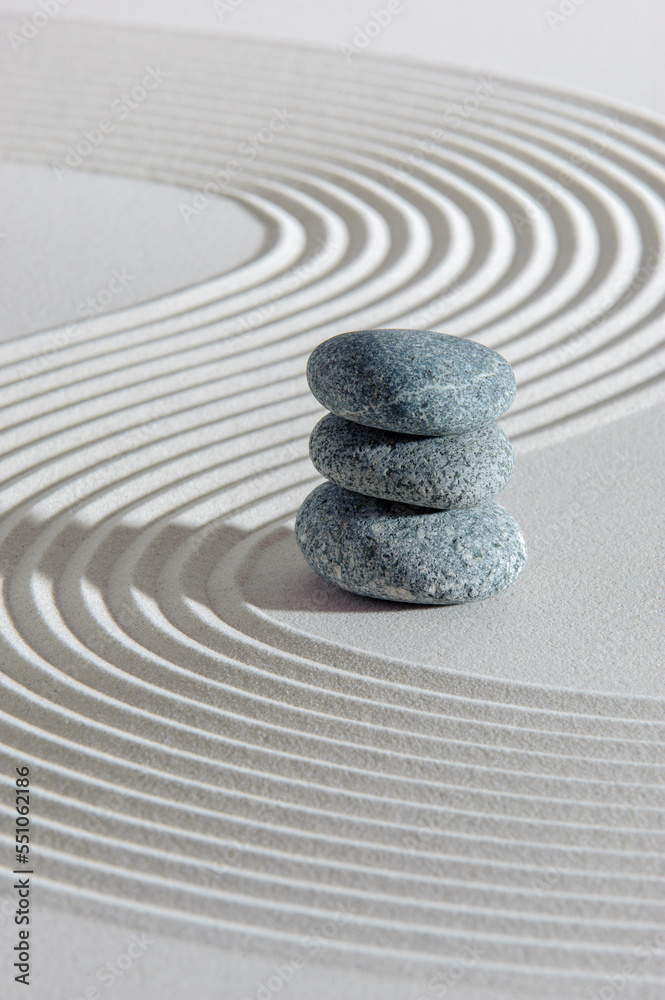 Japanese zen garden with stone in textured sand - obrazy, fototapety, plakaty 