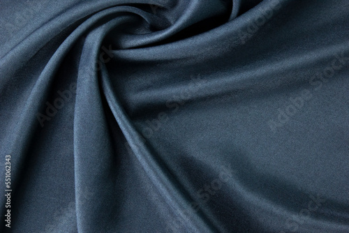 Smooth elegant dark blue silk for the luxury cloth texture and background design can used as abstract background concept design.