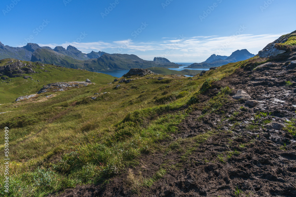 hiking mount ryten and kvalvika beach on lofoten islands in norway