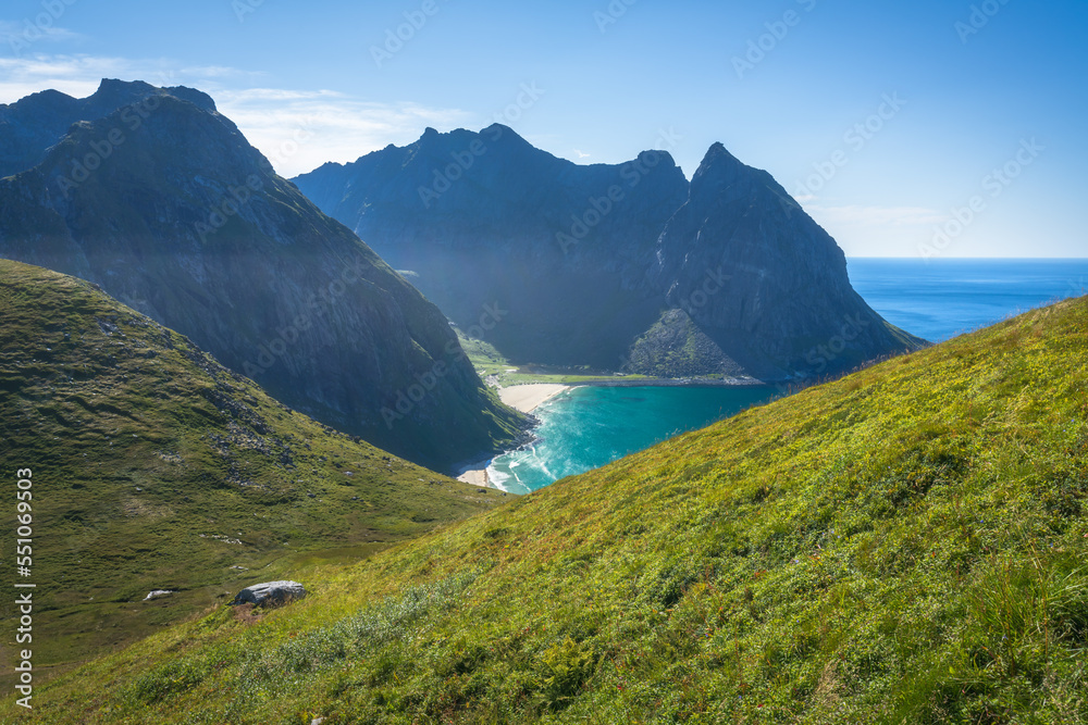 hiking mount ryten and kvalvika beach on lofoten islands in norway