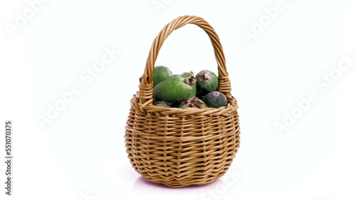 feijoa guava in basket isolated on white background photo