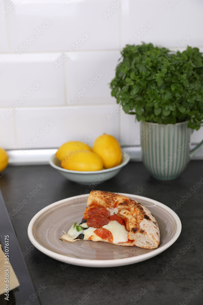 Neapolitan pizza with sausage and jalapeno in the kitchen at home Neapolitan pizza with sausage and jalapeno in the kitchen at home