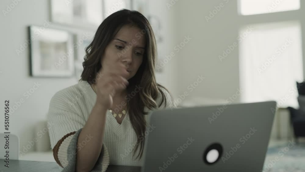 Close up of woman using laptop frustrated and confused / Lehi, Utah, United States Close up of woman using laptop frustrated and confused / Lehi, Utah, United States
