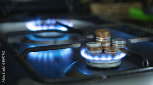 Burning gas stove and coins. Gas price © andranik123