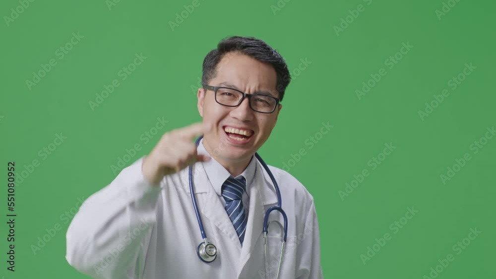 Close Up Of Asian Male Doctor With Stethoscope Shouting To Camera While Standing On Green Screen Background In The Hospital
Close Up Of Asian Male Doctor With Stethoscope Shouting To Camera While Standing On Green Screen Background In The Hospital