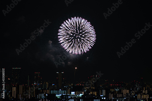 View of fireworks during a summer festival with a clear sky night (Toyonaka, Osaka, Japan) (20221203-004)