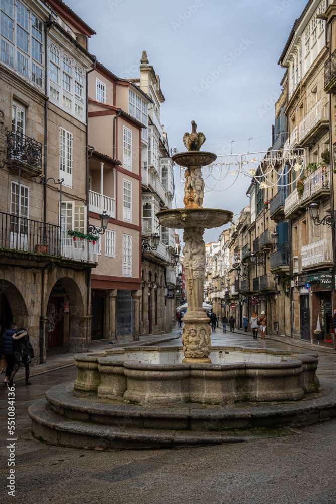 Praza do Ferro (Plaza del Hierro). Antique fountain the old town centre of Ourense, historic buildings and fountan on the stone streets. Galicia, Spain.