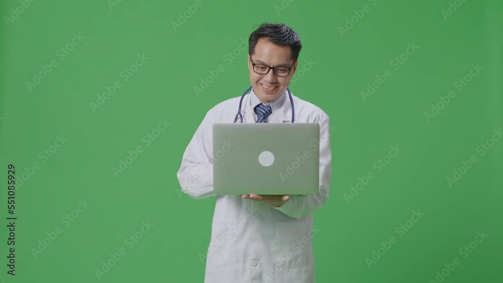 Asian Male Doctor With Stethoscope Typing On A Laptop And Smiling On Green Screen Background In The Hospital
Asian Male Doctor With Stethoscope Typing On A Laptop And Smiling On Green Screen Background In The Hospital