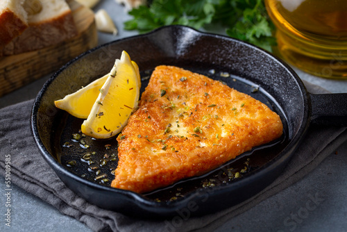 Saganaki is a Greek delicacy of fried cheese. photo