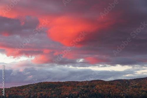 Colored clouds at sunset over  Massawippi lake in Canada photo