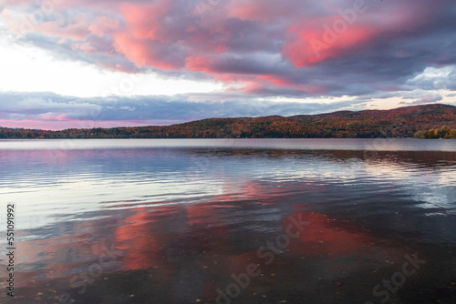 Fototapeta Naklejka Na Ścianę i Meble -  Colored clouds at sunset over  Massawippi lake in Canada