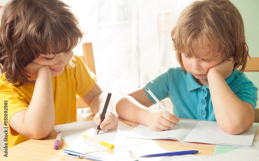 Two boy is doing his homework for elementary school Two boy is doing his homework for elementary school