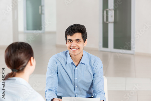 portrait of a young man at a business meeting