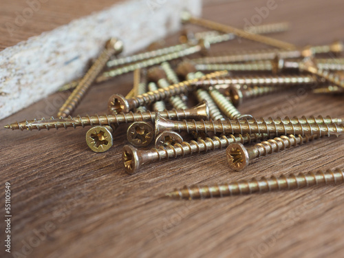 wood screws on manufactured wood panel photo