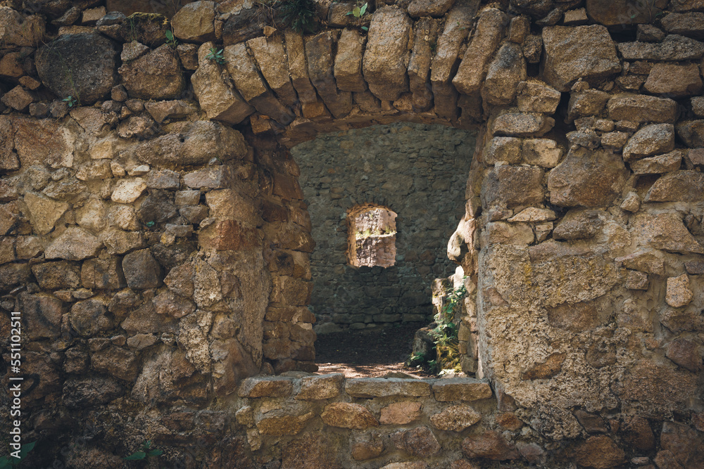 A window in the wall of a ruined castle