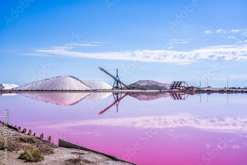 Salt production, pink lagoon and hills in the Mediterranean sea is located in Aigues-Mortes . Camargue, France. Hight quality photo