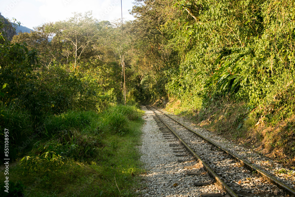 Hiking from Santa Teresa Hidroeléctrica to Aguas Calientes to reach Machupichu. Path following the train tracks with several hikers. Hiking from Santa Teresa Hidroeléctrica to Aguas Calientes to reach Machupichu. Path following the train tracks with several hikers.