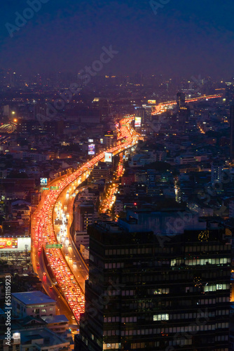 Aerial view of busy cars with traffic jam in the rush hour on highway road street on bridge in Bangkok Downtown, urban city in Asia, Thailand at sunset. Intersection junction. Toll gate in Rama 9 © tampatra