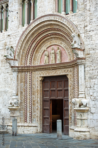 Perugia. Portale delle Arti di Palazzo dei Priori. Sculture dei tre Santi Patroni e del grifo, simboli della città photo