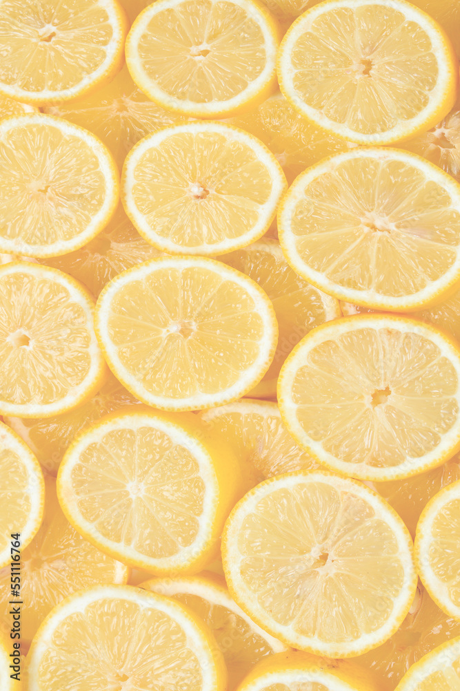 A slices of fresh juicy yellow lemons. Texture background, pattern. A slices of fresh juicy yellow lemons. Texture background, pattern.