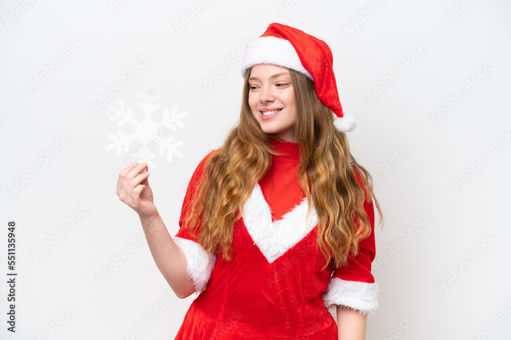 Young caucasian woman with Christmas dress holding snowflake isolated on white background with happy expression Young caucasian woman with Christmas dress holding snowflake isolated on white background with happy expression