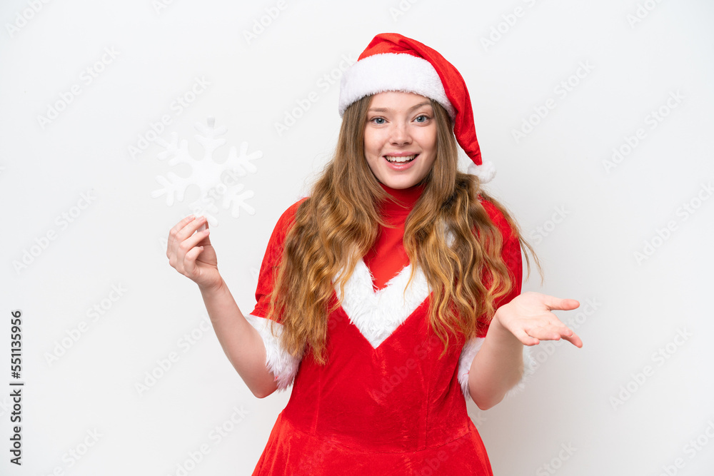 Young caucasian woman with Christmas dress holding snowflake isolated on white background with shocked facial expression Young caucasian woman with Christmas dress holding snowflake isolated on white background with shocked facial expression