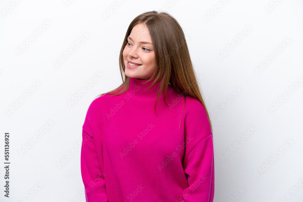 Young caucasian woman isolated on white background looking to the side and smiling Young caucasian woman isolated on white background looking to the side and smiling