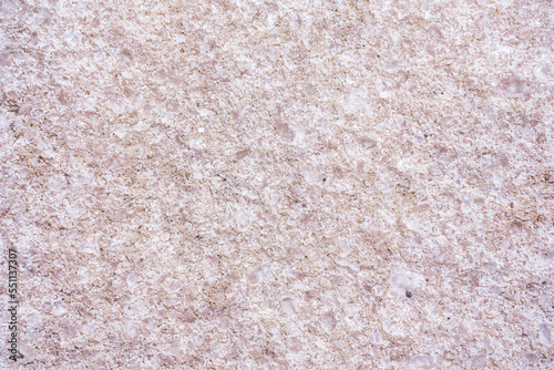 Textured background of the pink salt. Selective focus. Close up of pink salt. High quality photo