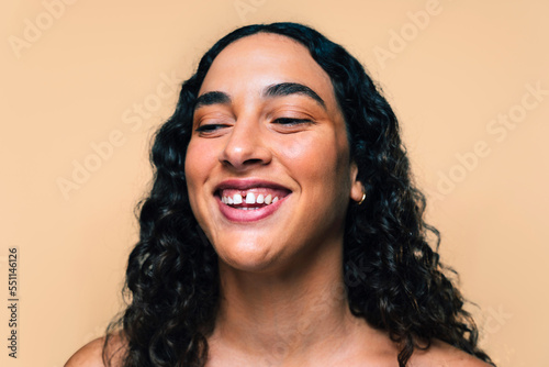 Beauty studio portrait of beautiful young woman with diastema - Confident and interesting female with diverse and unique style, concepts about skin care, body care, individuality and body acceptance