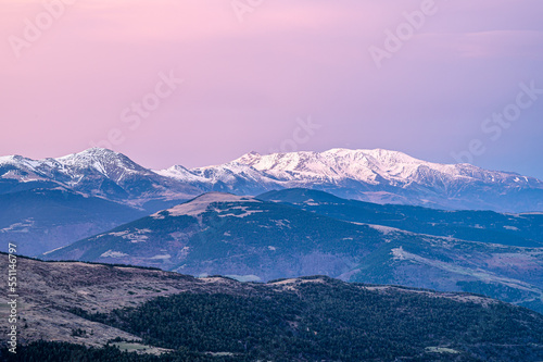 Snow covered mountains in winter (crimson sky)