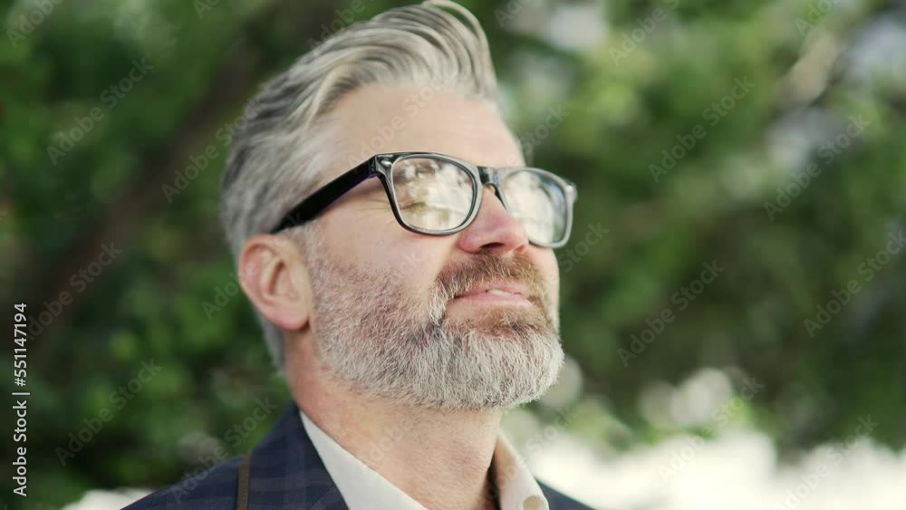 Close up portrait of smiling mature businessman with glasses takes a deep breath of fresh air outdoors Calm inspired serene office worker with closed eyes take a break while resting for peaceful mind Close up portrait of smiling mature businessman with glasses takes a deep breath of fresh air outdoors Calm inspired serene office worker with closed eyes take a break while resting for peaceful mind