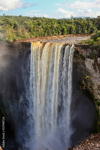 Kayetur Waterfall with clouds of spray and fog on a clear sunny day in the jungle  Guyana. Subtropics  world tourism.