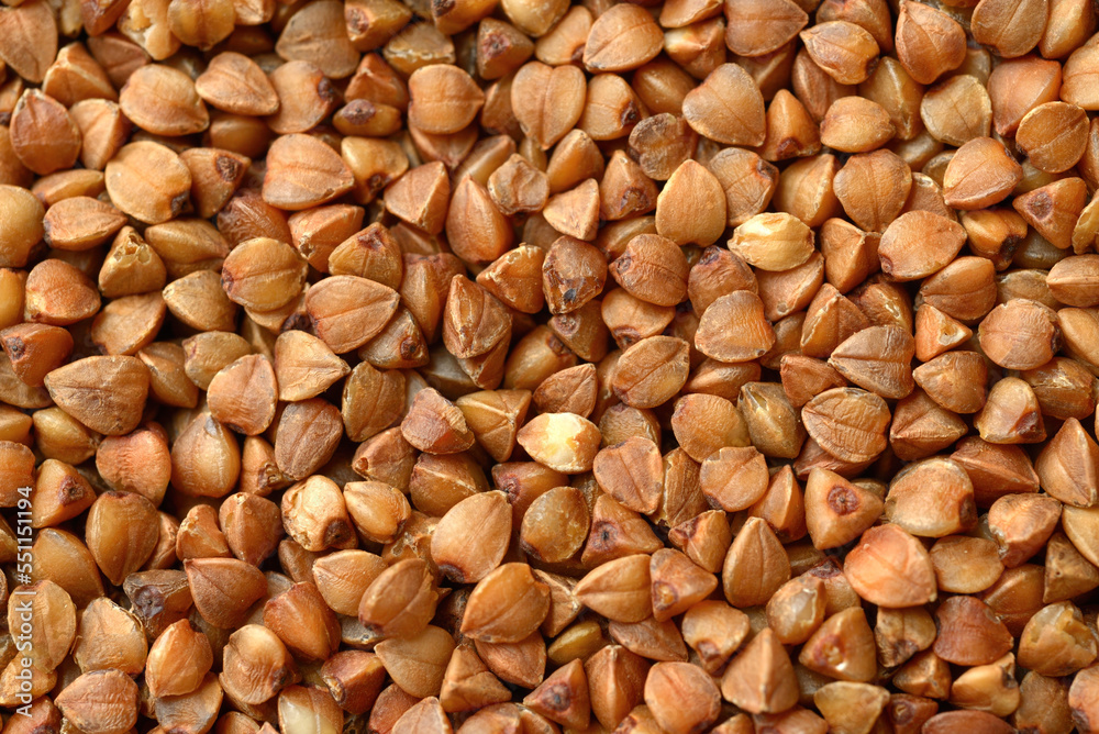 Raw uncooked buckwheat texture background, buckwheat macro shot Raw uncooked buckwheat texture background, buckwheat macro shot