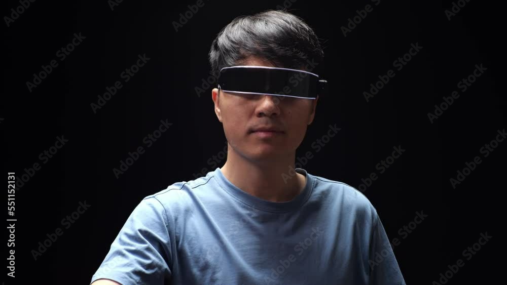 Close Up Of Asian Man Touching And Swiping Virtual Reality With Hand While Using Futuristic Goggles. Player Touching Air Panel
Close Up Of Asian Man Touching And Swiping Virtual Reality With Hand While Using Futuristic Goggles. Player Touching Air Panel