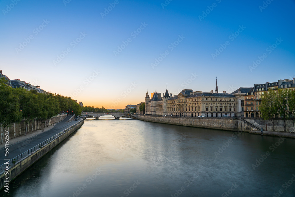 Conciergerie palace and prison by the Seine river at sunrise in Paris. France