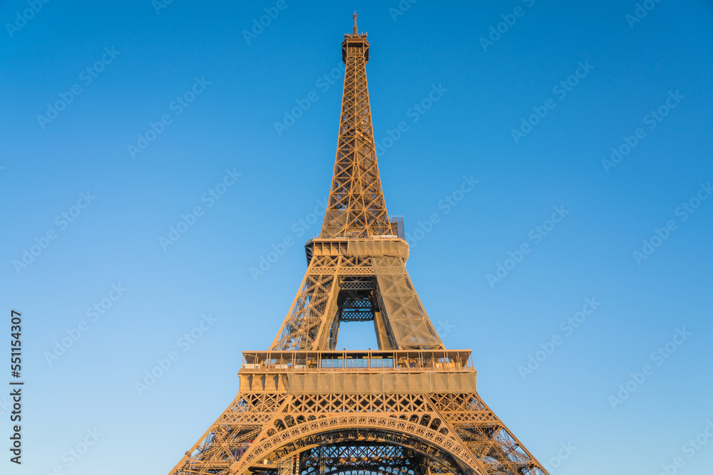 Eiffel Tower close up view against blue sky in Paris. France