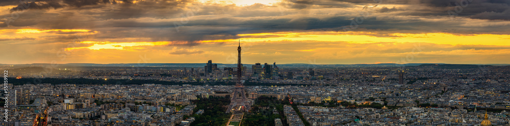 Aerial panorama of Paris with Eiffel Tower at sunset. France