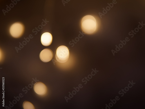 Golden and dark brown round bokeh lights festive background © Наталья Добровольска